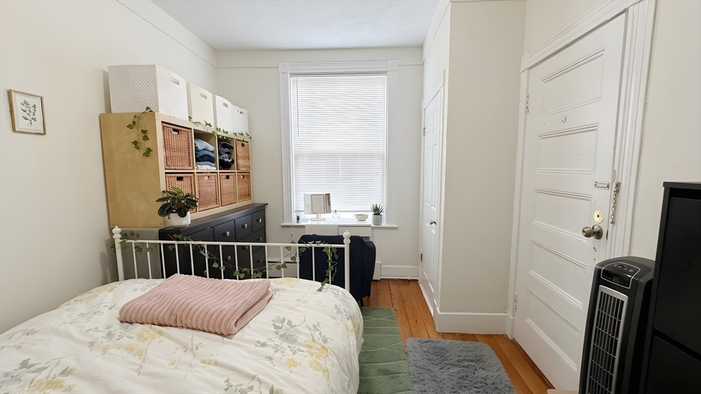 26 Darling Street, Unit 2 Boston, MA 02120 - Photo 11 of 15 a bedroom with a bed and a window