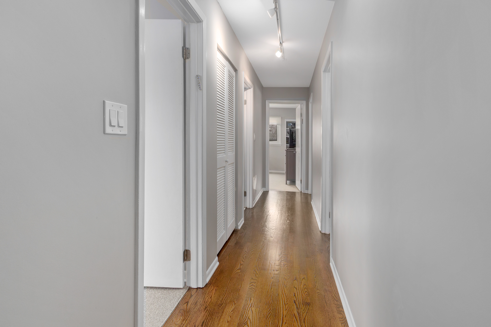 29 Ellendale Road Deerfield, IL 60015 - Photo 8 of 35 a view of a hallway with wooden floor