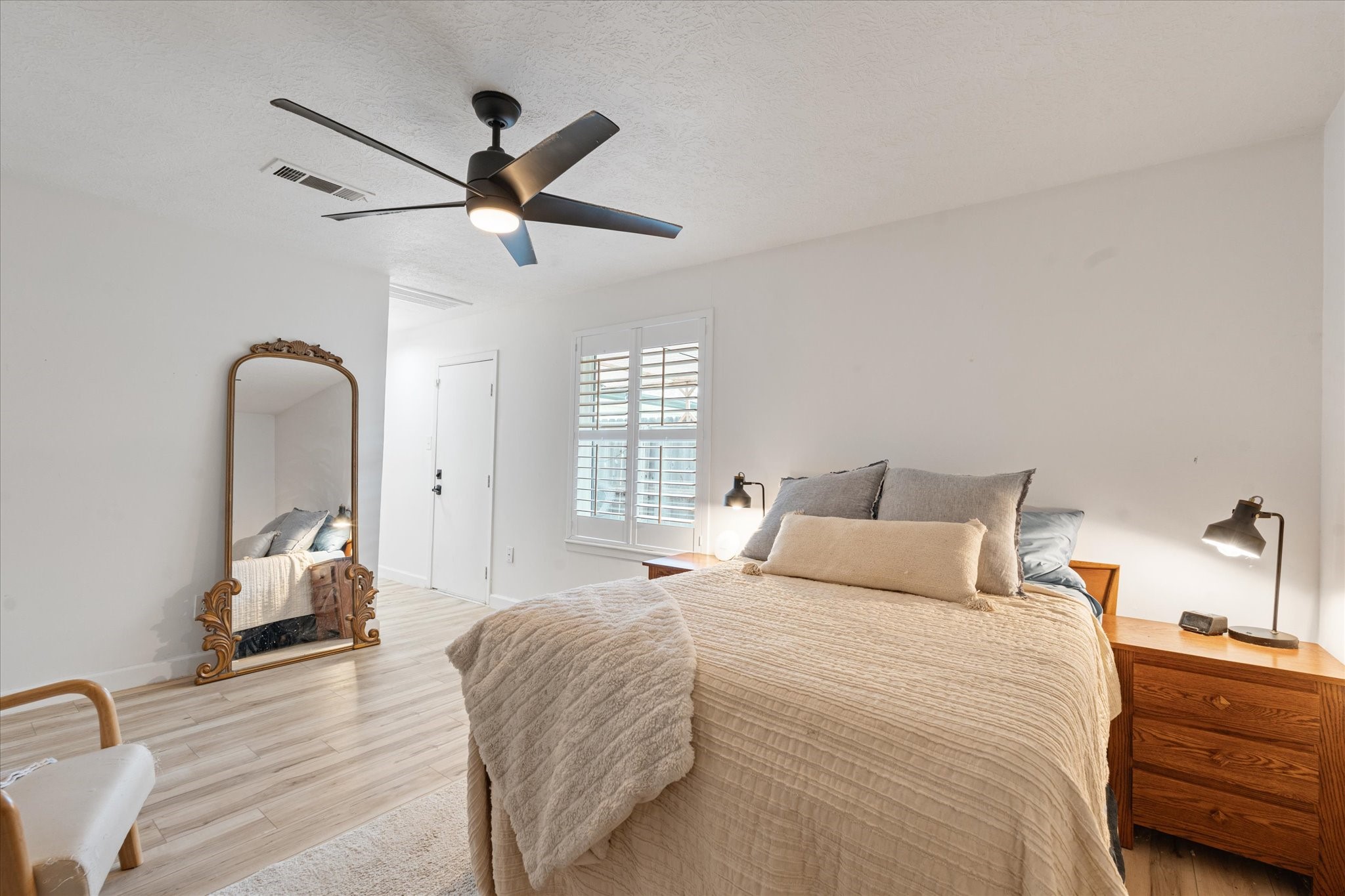 110 Dozent Lane Baytown, TX 77521 - Photo 17 of 36 Experience the spacious primary bedroom with exclusive access to a private patio.