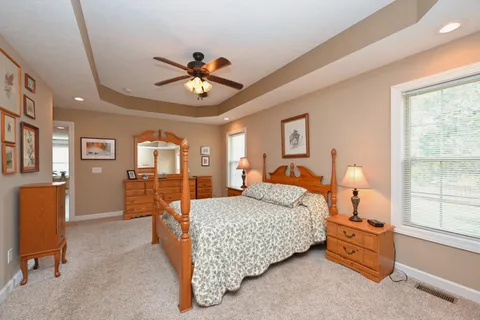 a bedroom with furniture and window