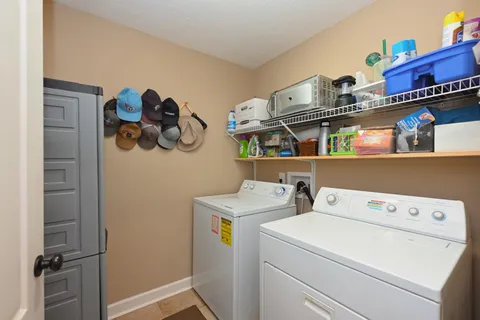 a view of storage and utility room with washer and dryer