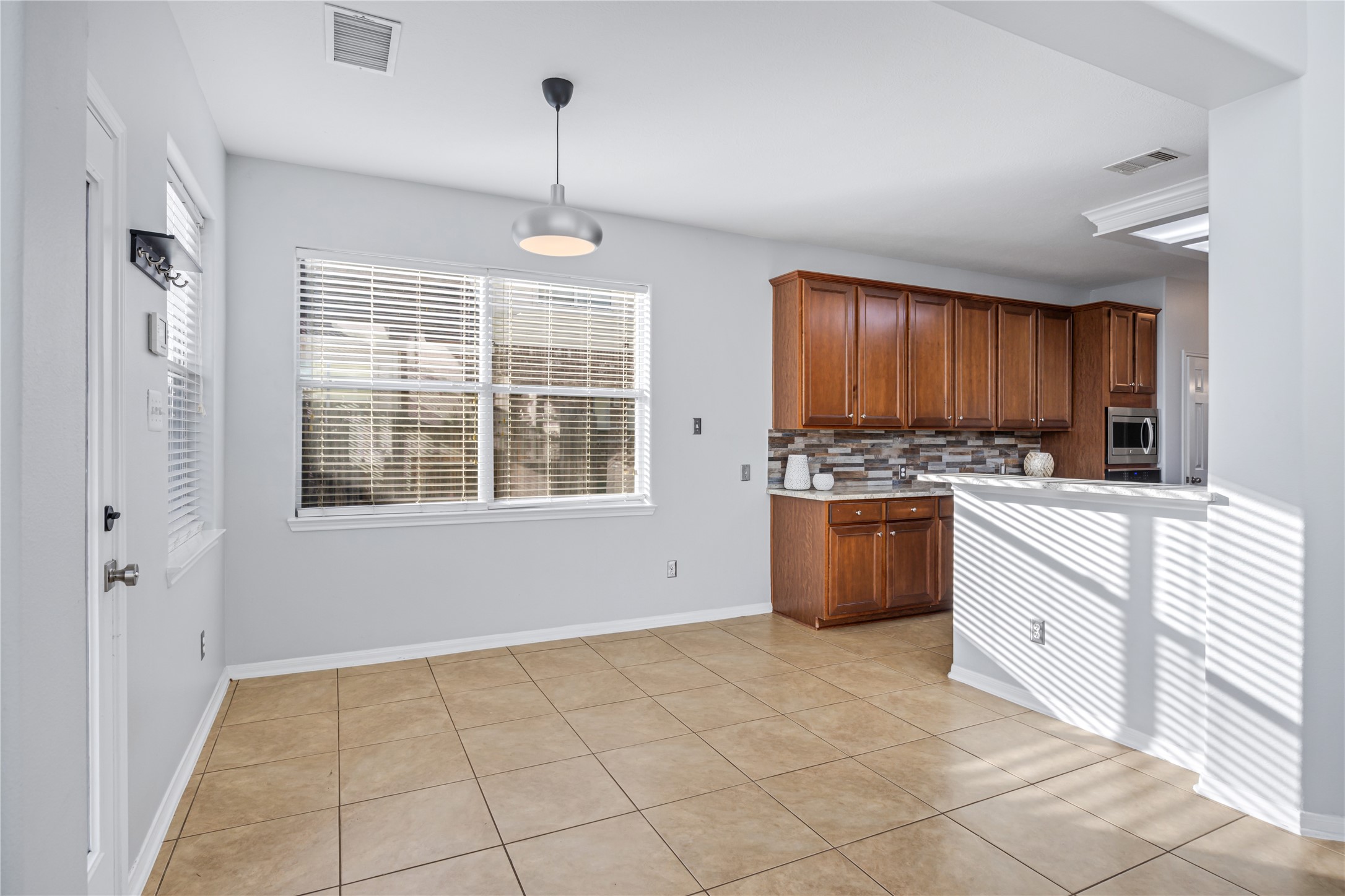 6727 Montay Bay Drive Spring, TX 77389 - Photo 11 of 41 a kitchen with a stove a sink and a refrigerator