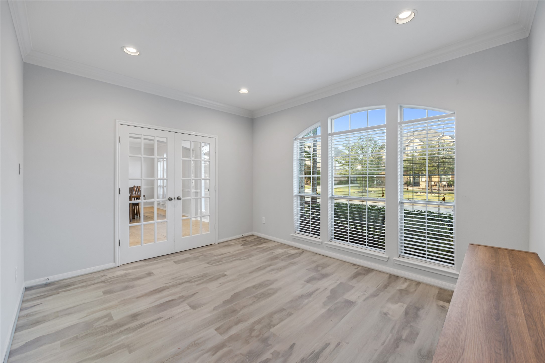 6727 Montay Bay Drive Spring, TX 77389 - Photo 12 of 41 a view of an empty room with wooden floor and a window