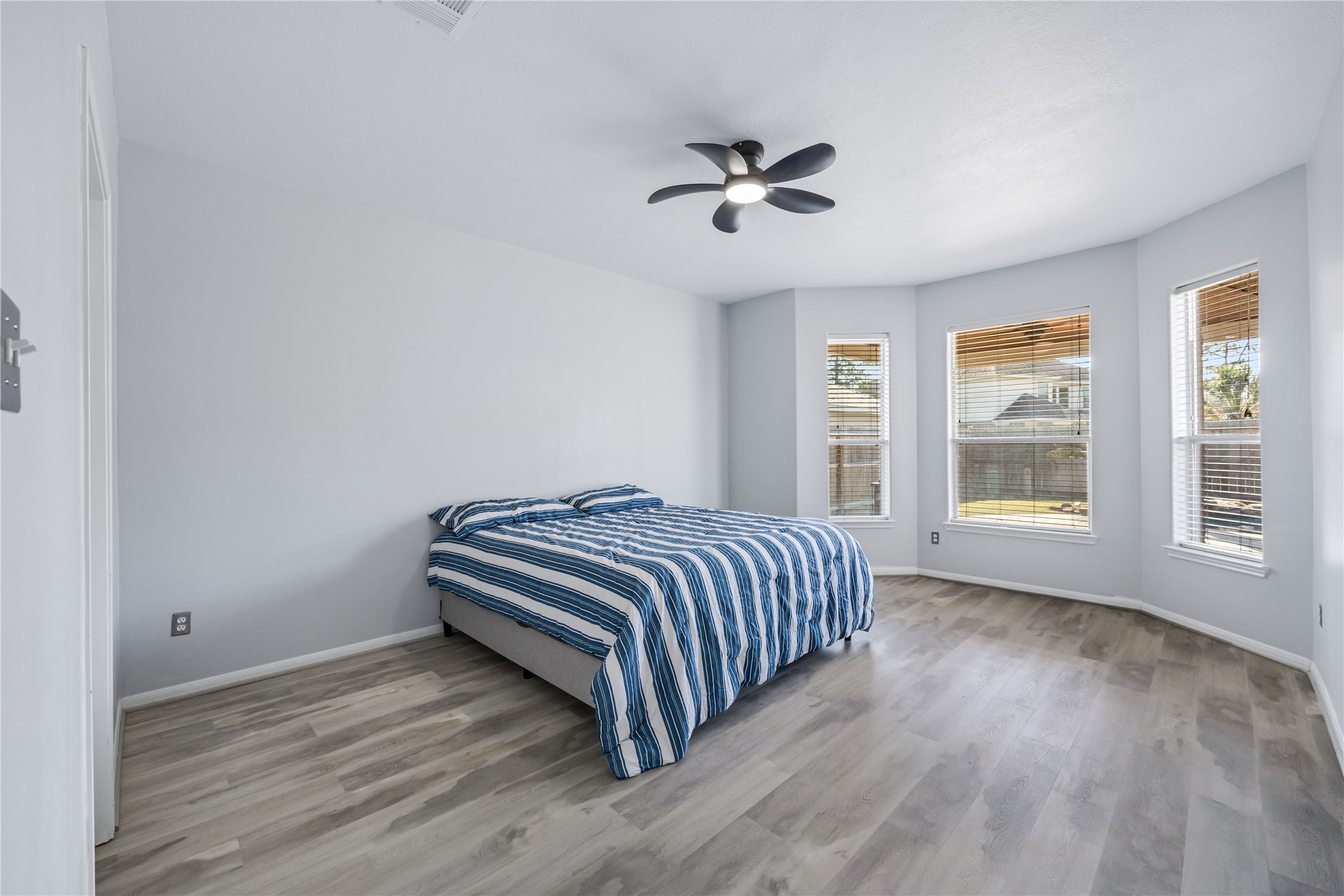 6727 Montay Bay Drive Spring, TX 77389 - Photo 19 of 41 a view of a room with wooden floor and windows