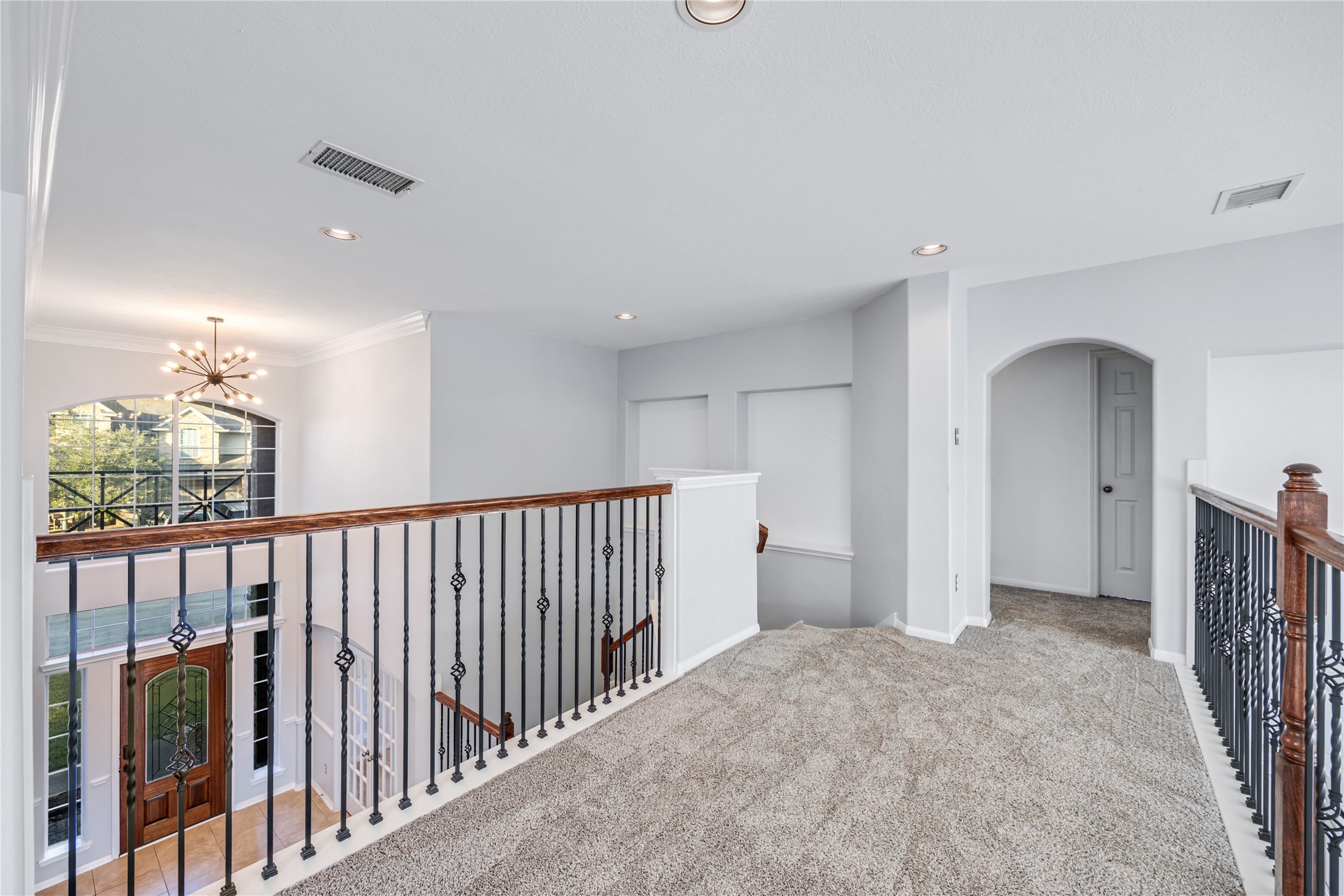 6727 Montay Bay Drive Spring, TX 77389 - Photo 23 of 41 a view of hallway with chandelier