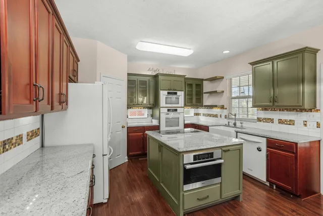 a kitchen with a stove and a sink