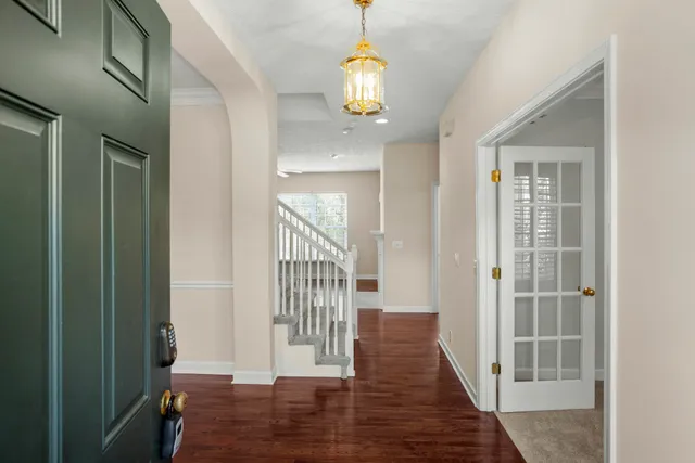 a view of entryway with wooden floor
