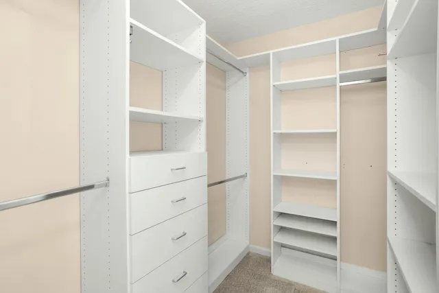 a view of a porch with furniture and a fireplace