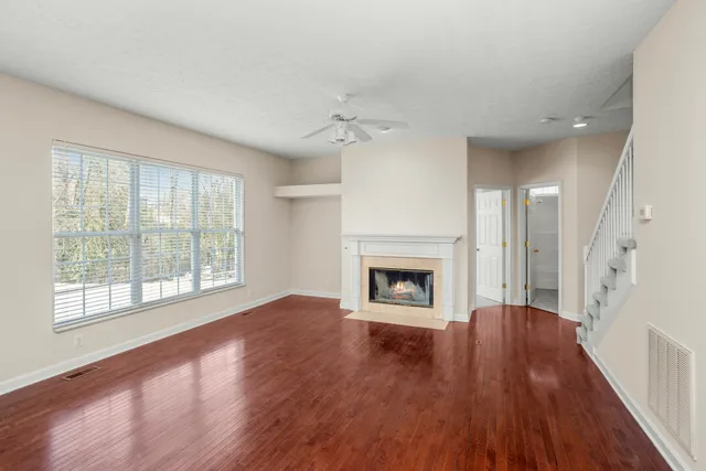 wooden floor in an empty room with a fireplace