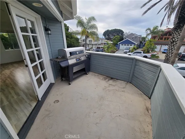 a view of balcony with outdoor seating and stairs