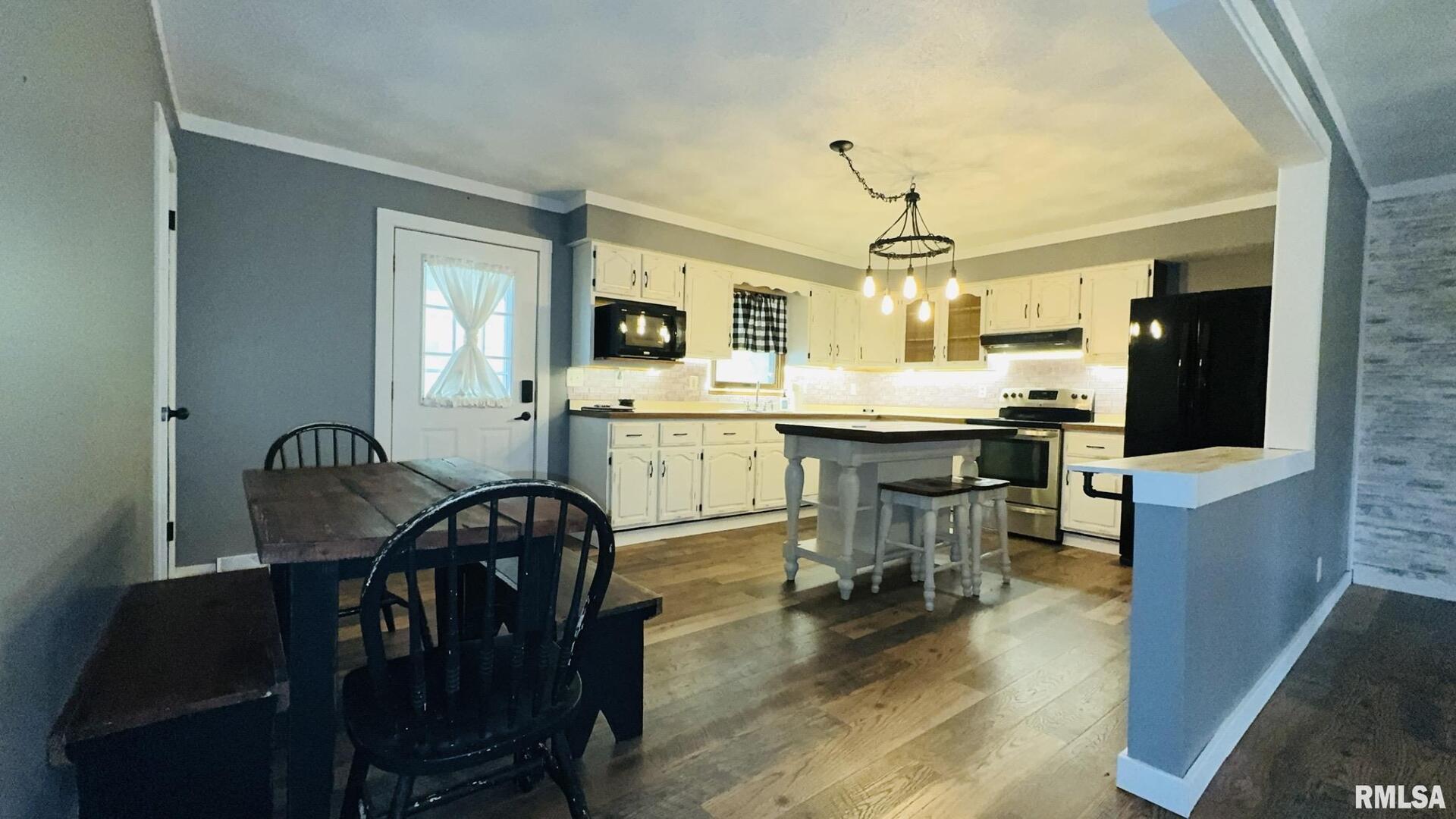5381 Center Street Mulkeytown, IL 62865 - Photo 22 of 34 a view of a dining room with furniture window and wooden floor