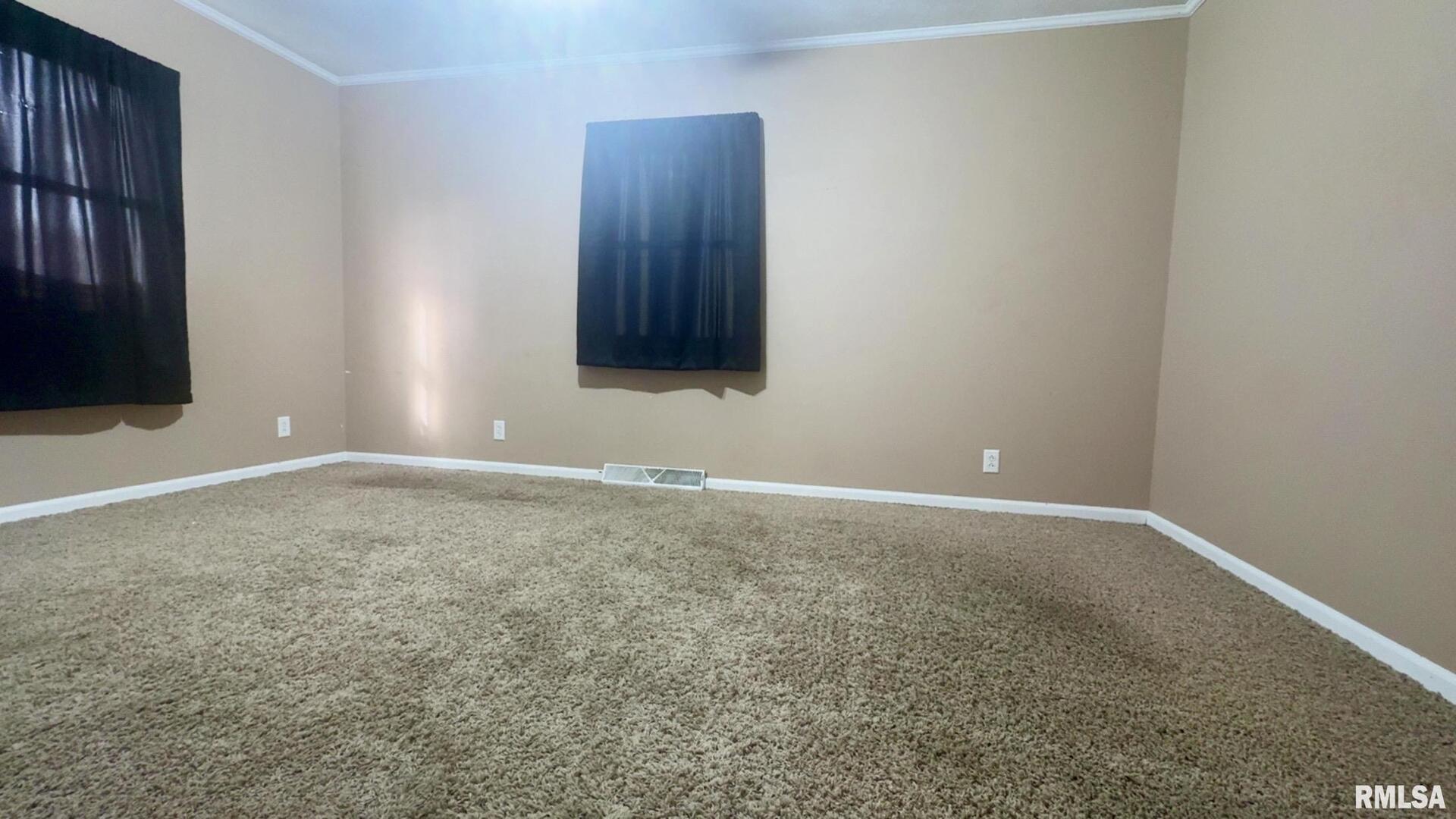 5381 Center Street Mulkeytown, IL 62865 - Photo 27 of 34 a view of an empty room with wooden floor and a window