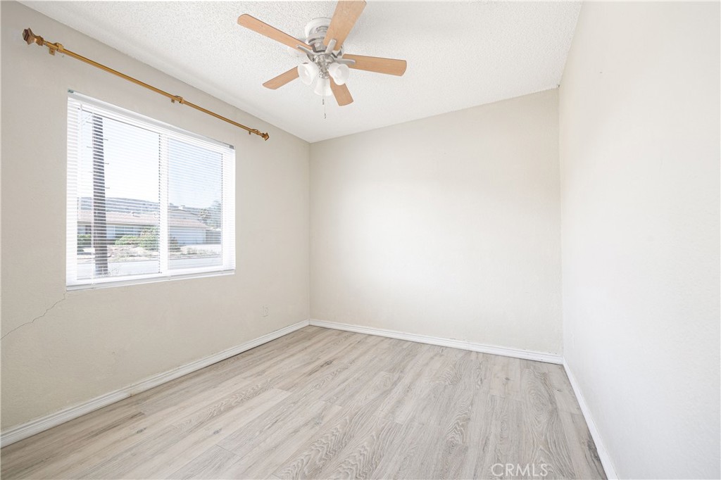 14514 Kennebunk Street Poway, CA 92064 - Photo 11 of 29 wooden floor in an empty room with a window