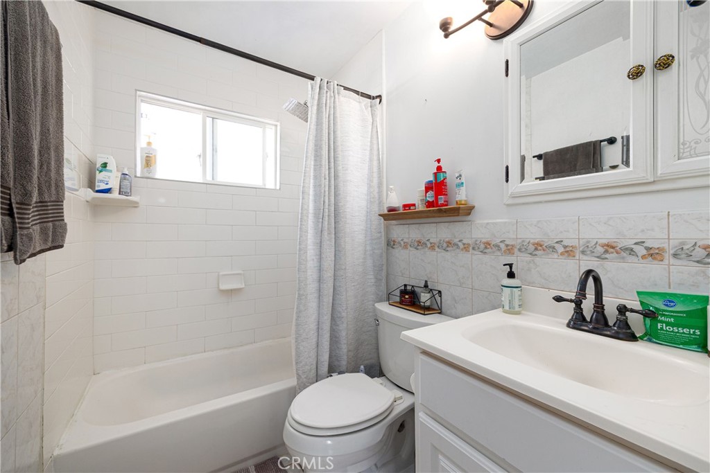 14514 Kennebunk Street Poway, CA 92064 - Photo 12 of 29 a bathroom with a toilet sink and a bathtub