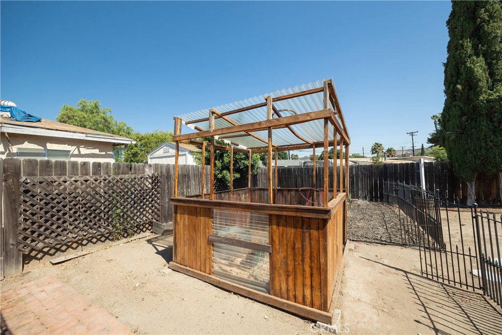 14514 Kennebunk Street Poway, CA 92064 - Photo 16 of 29 a view of a terrace with wooden fence