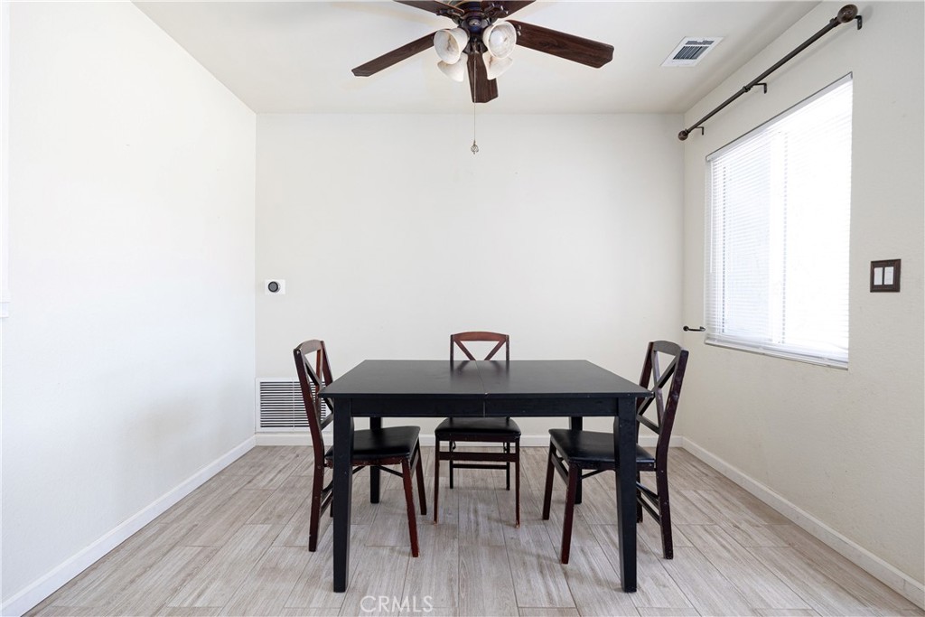14514 Kennebunk Street Poway, CA 92064 - Photo 5 of 29 a view of a dining room with furniture and a window