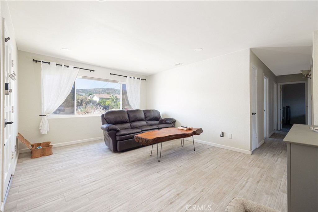 14514 Kennebunk Street Poway, CA 92064 - Photo 6 of 29 a living room with furniture and a window