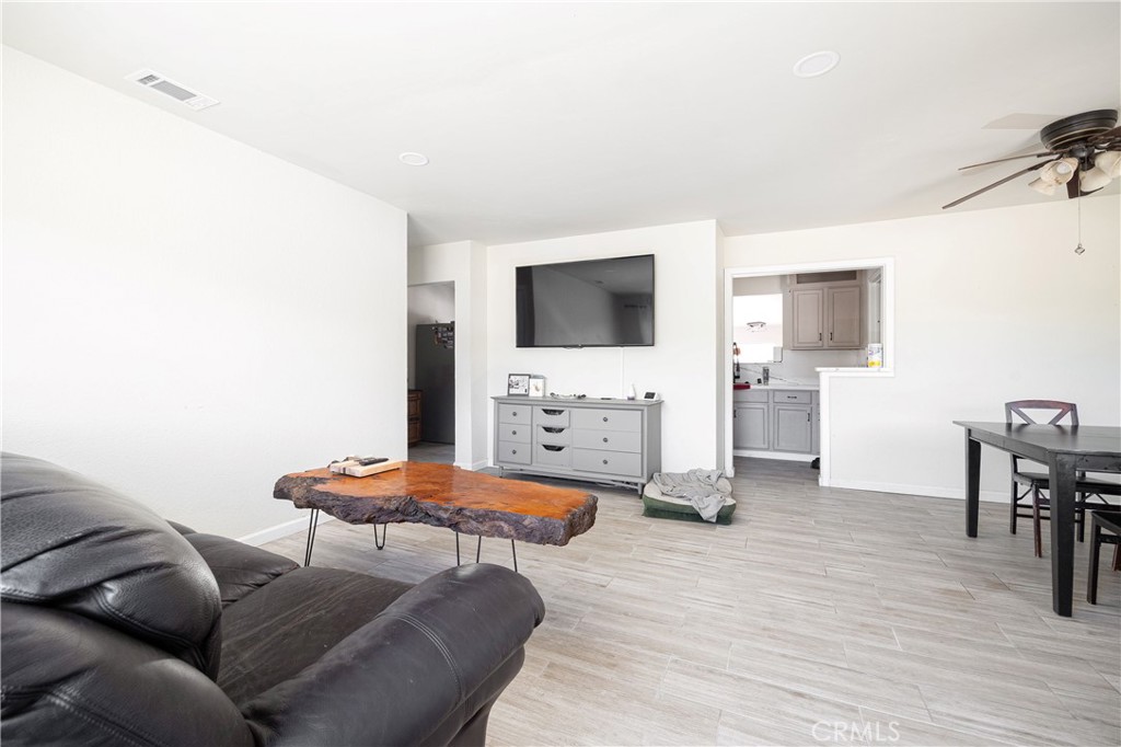 14514 Kennebunk Street Poway, CA 92064 - Photo 7 of 29 a living room with furniture and a flat screen tv