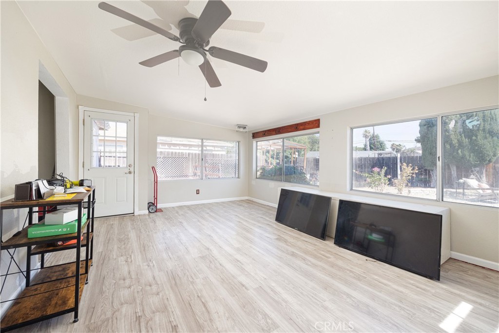 14514 Kennebunk Street Poway, CA 92064 - Photo 9 of 29 a living room with furniture and a large window with wooden floor