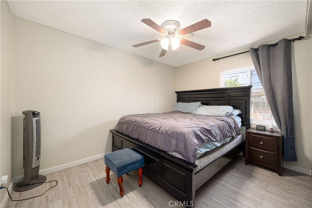 14514 Kennebunk Street Poway, CA 92064 - Photo 10 of 29 a bedroom with a bed and a flat screen tv