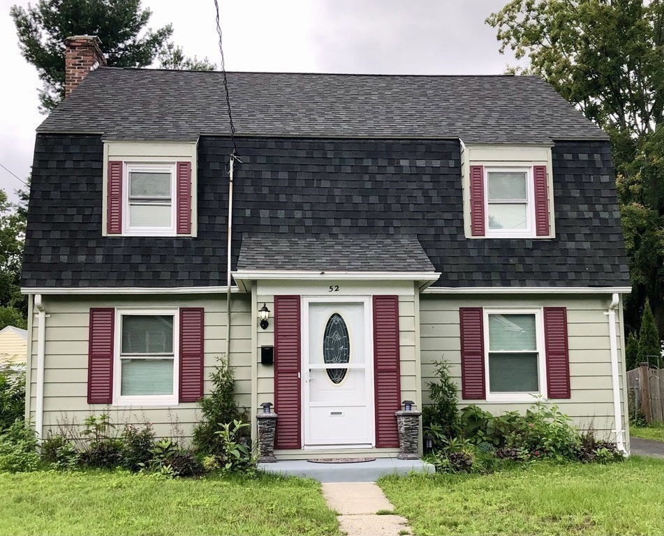 front view of a house with a small yard