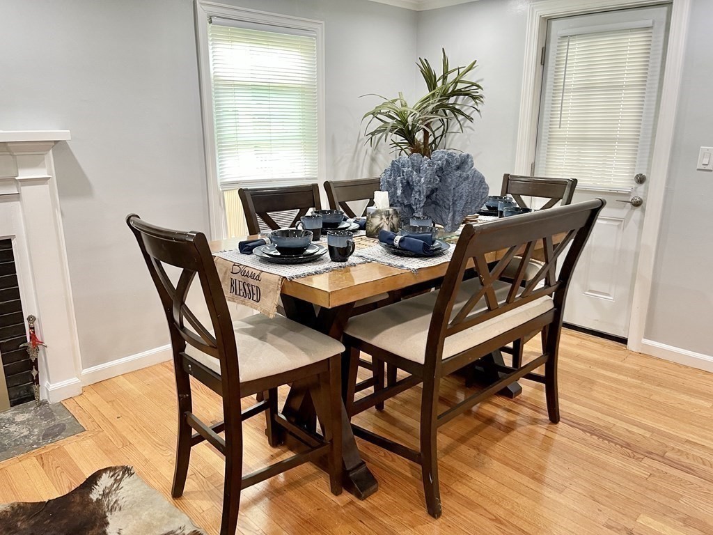52 Mandalay Road Springfield, MA 01118 - Photo 11 of 24 a view of a dining room with furniture and wooden floor