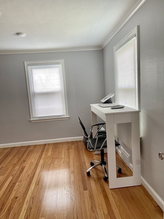 52 Mandalay Road Springfield, MA 01118 - Photo 13 of 24 a view of a workspace with wooden floor and a window