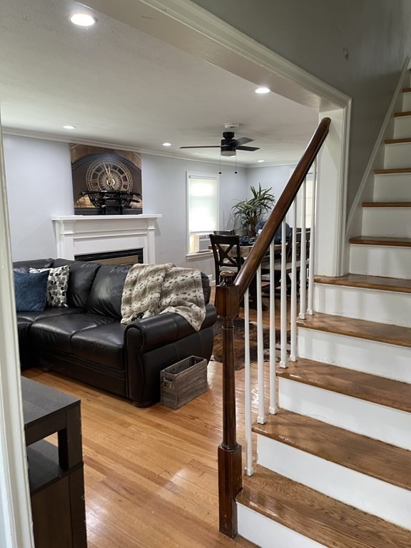 52 Mandalay Road Springfield, MA 01118 - Photo 14 of 24 a living room with wooden floor and a fireplace