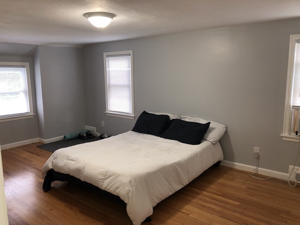 52 Mandalay Road Springfield, MA 01118 - Photo 17 of 24 a bedroom with a bed and wooden floor