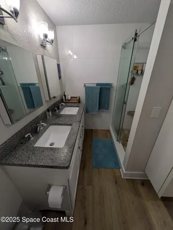 a bathroom with a sink a vanity and mirror
