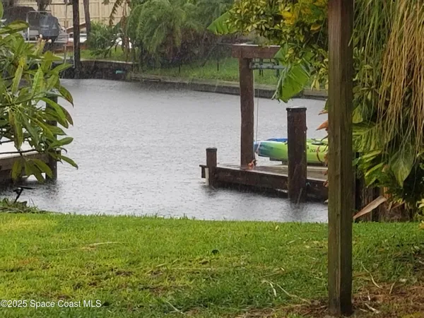 a view of a backyard with sitting area