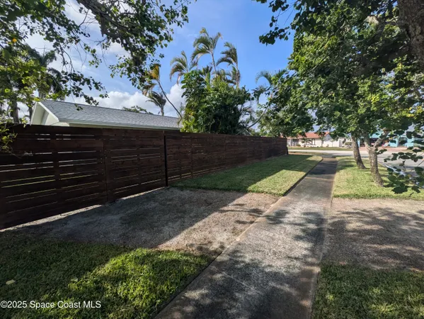 a view of backyard with green space