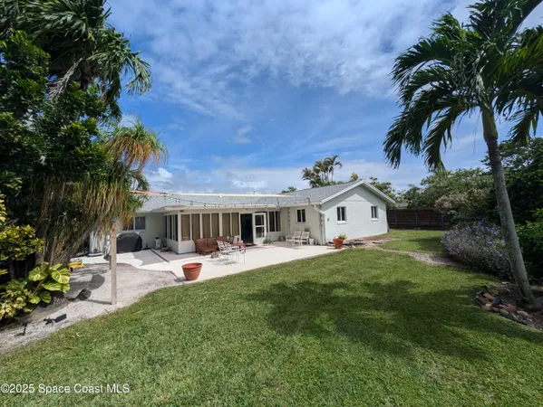 a view of yard with patio