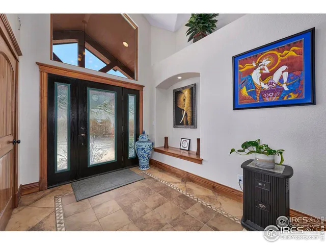 a room with pool tables and windows