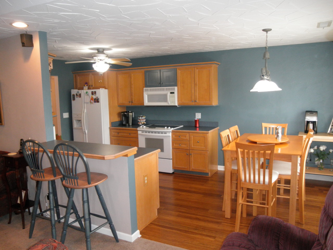 9316 Stewartsville Road Moneta, VA 24121 - Photo 12 of 34 a kitchen with stainless steel appliances kitchen island granite countertop a table and chairs in it