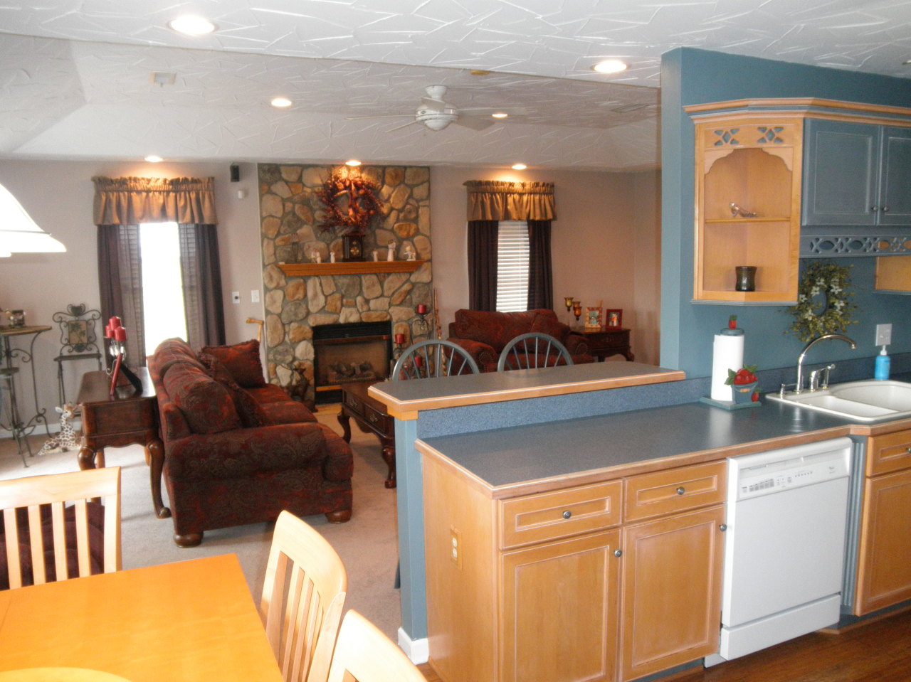9316 Stewartsville Road Moneta, VA 24121 - Photo 13 of 34 a living room with furniture a fireplace and a large window