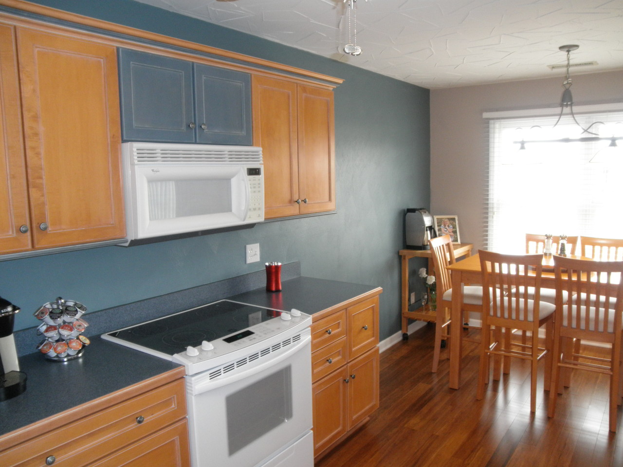 9316 Stewartsville Road Moneta, VA 24121 - Photo 15 of 34 a kitchen with a wooden floor a stove and a window