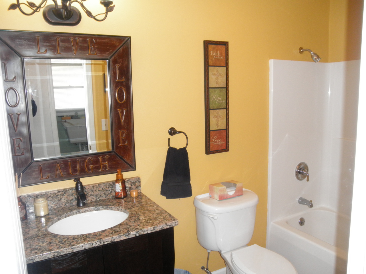 9316 Stewartsville Road Moneta, VA 24121 - Photo 17 of 34 a bathroom with a granite countertop sink and a mirror
