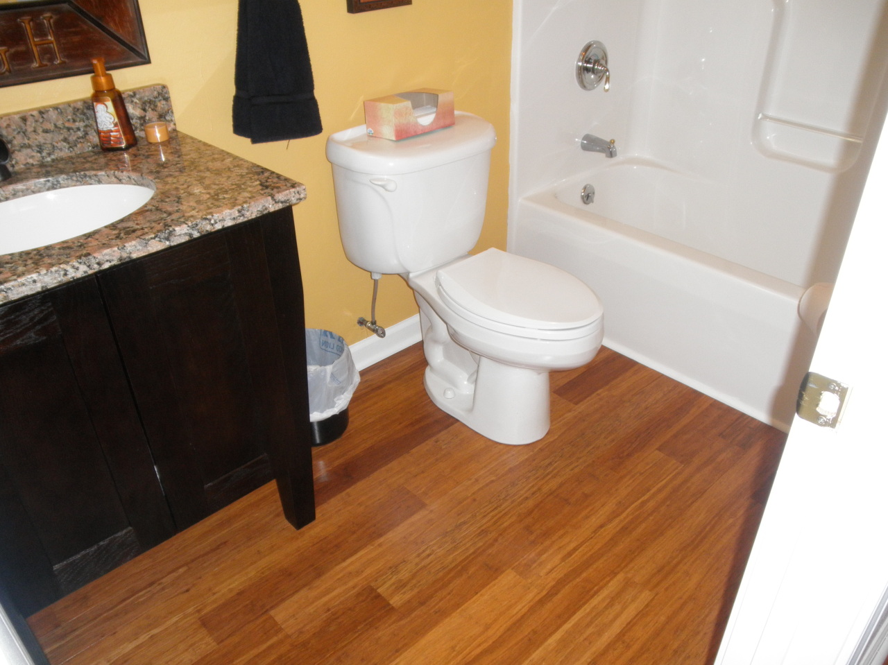 9316 Stewartsville Road Moneta, VA 24121 - Photo 18 of 34 a bathroom with a granite countertop sink toilet and bathtub