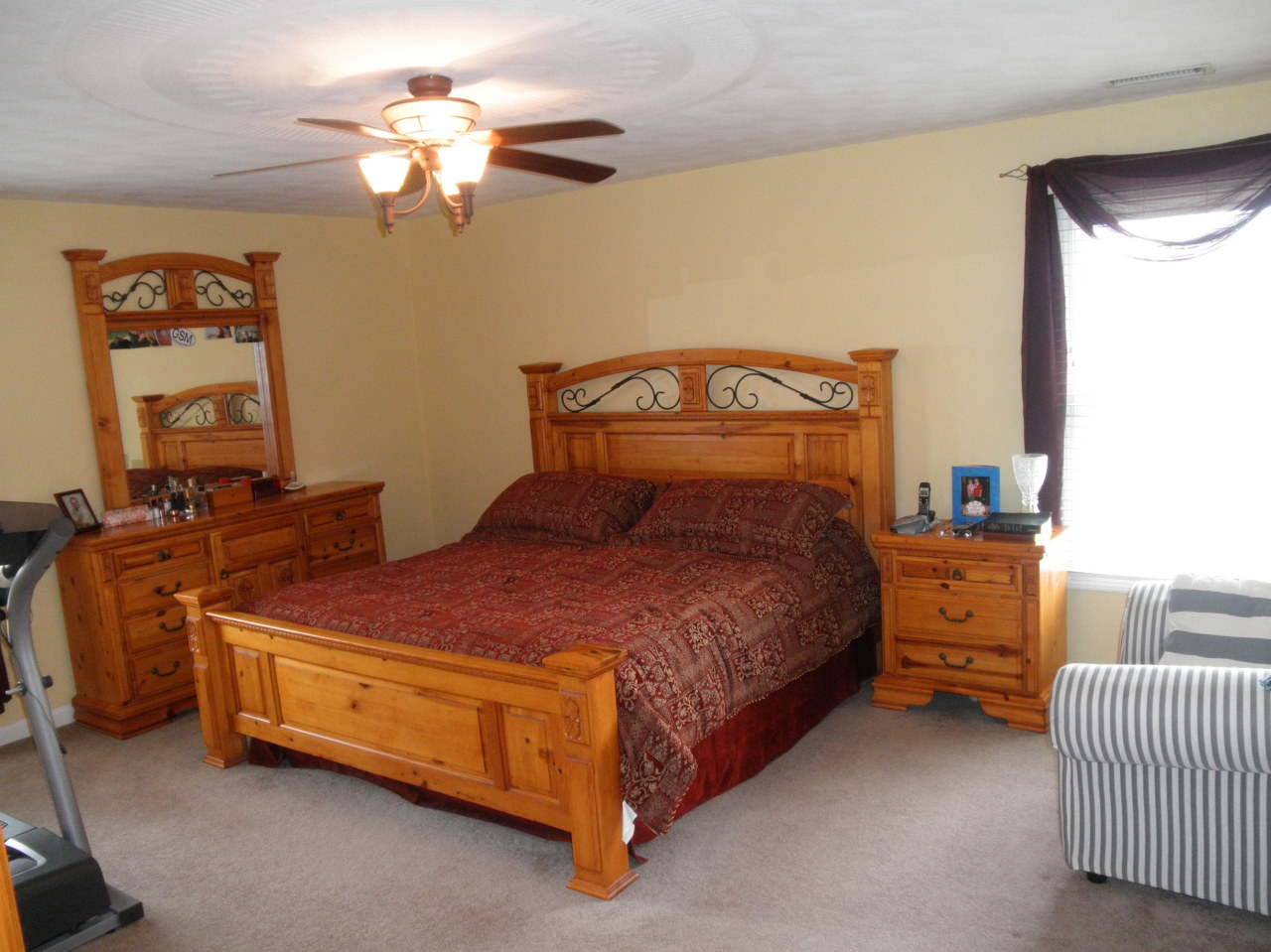 9316 Stewartsville Road Moneta, VA 24121 - Photo 19 of 34 a bedroom with a bed and a chandelier