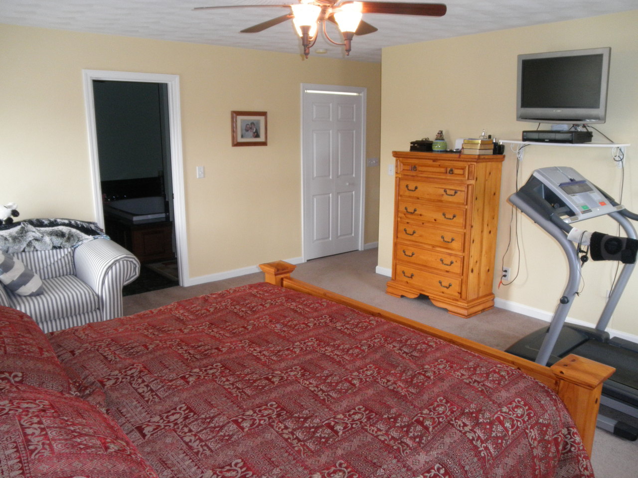 9316 Stewartsville Road Moneta, VA 24121 - Photo 20 of 34 a bedroom with a bed and flat screen tv