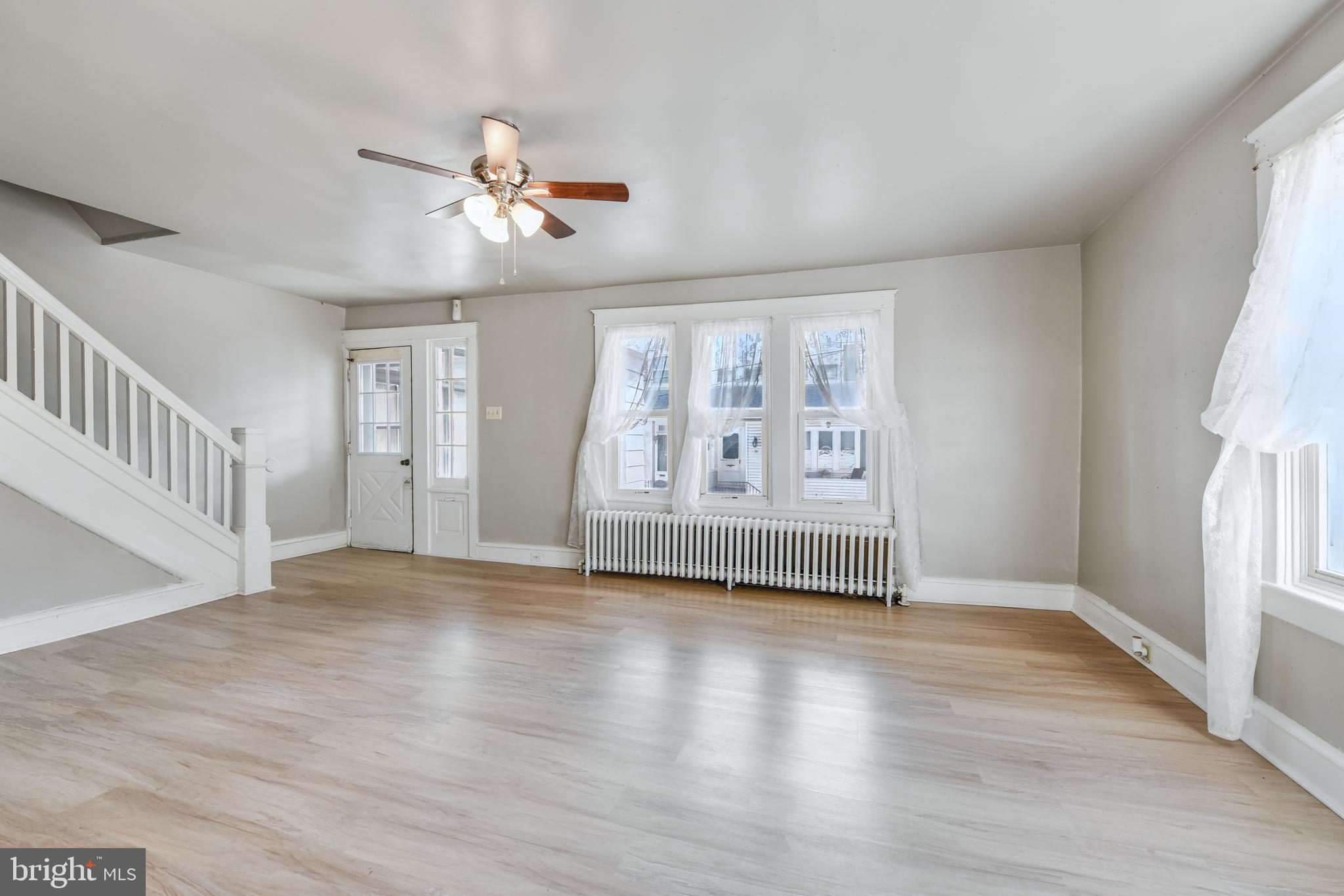 20 Pennwyn Terrace Reading, PA 19606 - Photo 5 of 16 a view of an empty room with a window and wooden floor
