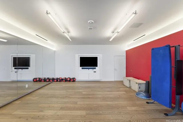 a view of a fire pit and a tall tree in the park