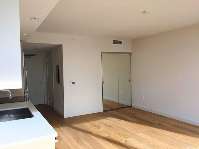 a bedroom with a bed and a view of bedroom