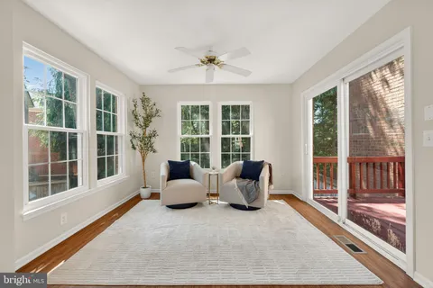 a living room with furniture and windows