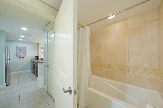 a bathroom with a shower and a tub