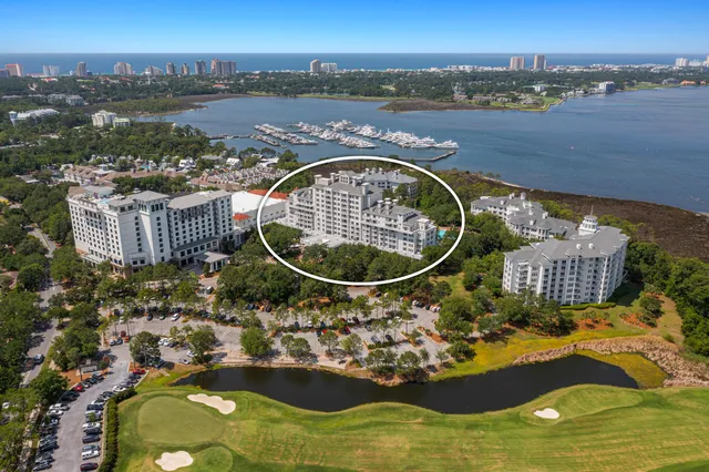 an aerial view of a house with a tub and city view