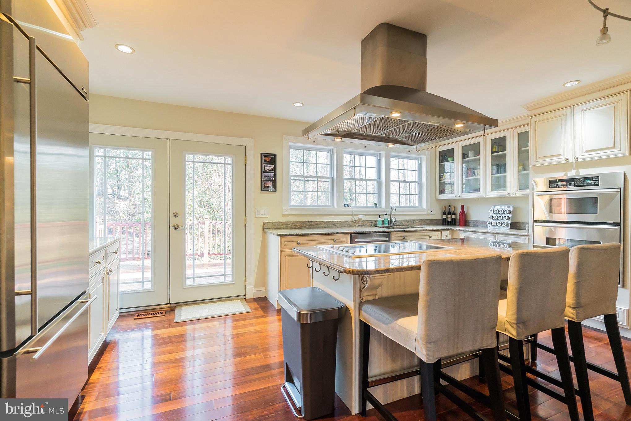 11710 Ayreshire Road Oakton, VA 22124 - Photo 8 of 30 Kitchen with entry to deck and backyard