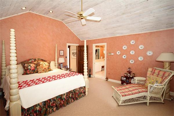 47 Walnut Road Weston, MA 02493 - Photo 17 of 25 a bedroom with a bed and a chandelier