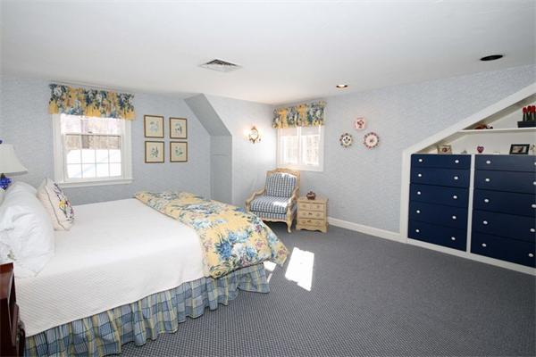 47 Walnut Road Weston, MA 02493 - Photo 20 of 25 a bedroom with a bed and a window